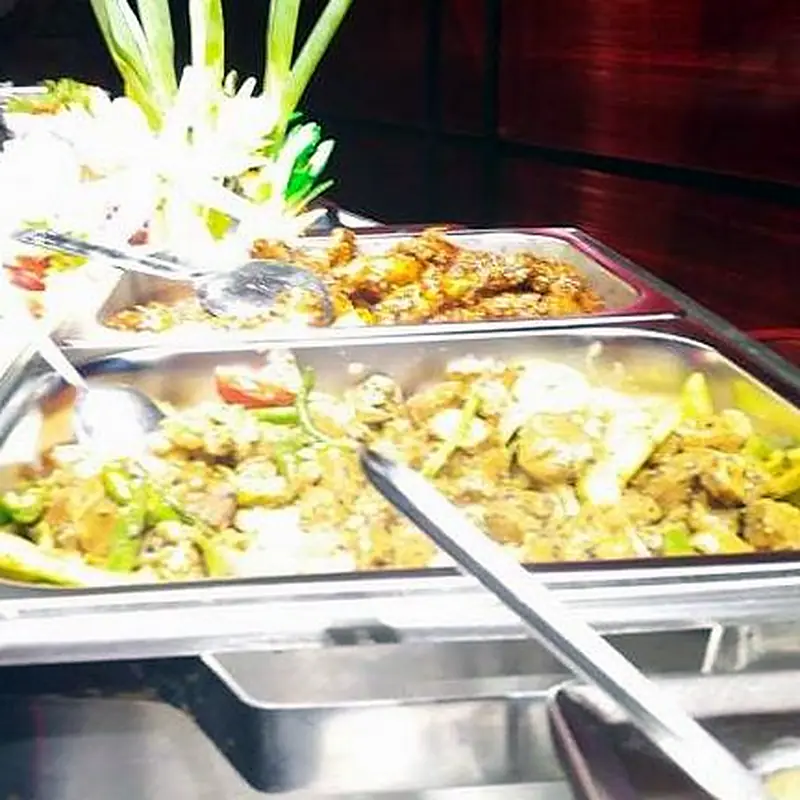 Buffet trays of curries in the red dining room at Restaurant Two